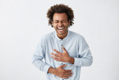 https://positiveroutines.com/wp-content/uploads/2017/11/black-man-laughing-holding-stomach.jpg